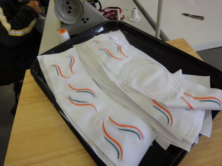 Each waistband is embrodiered before appliques and stones are applied.