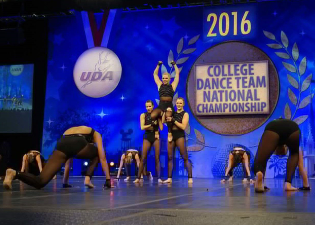 University of S. Thomas Dance team jazz costume, Ronda Rousey, Black edgy costume, low back , crop top and briefs