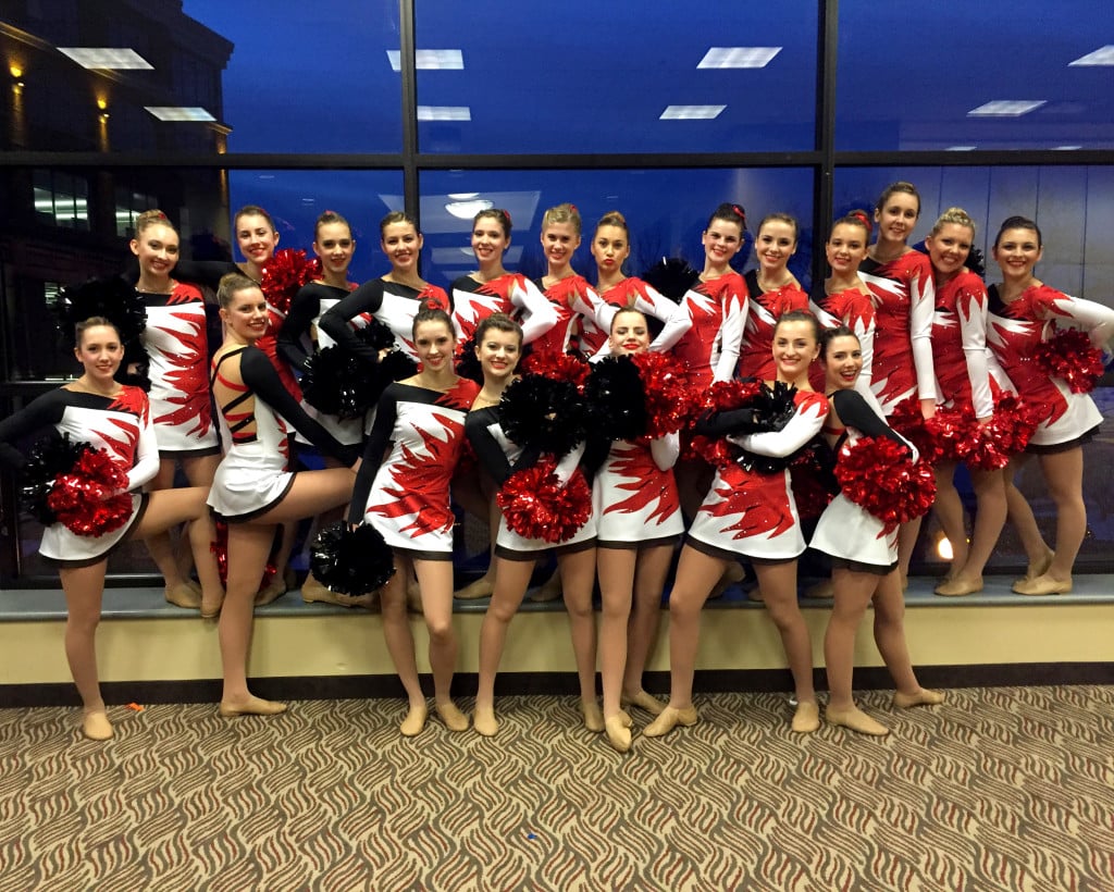 Hortonville pom, black, red and white costume with flame