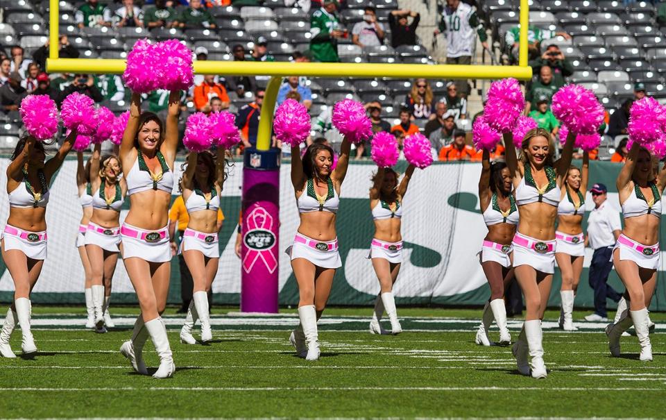 New York Jets Flight Crew cheerleaders in the signature cheer uniform for Breast Cancer awareness month