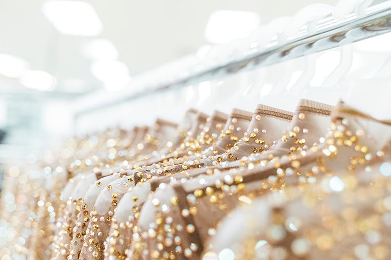 The Ohio State University dance team jazz uniforms hanging on a garment rack