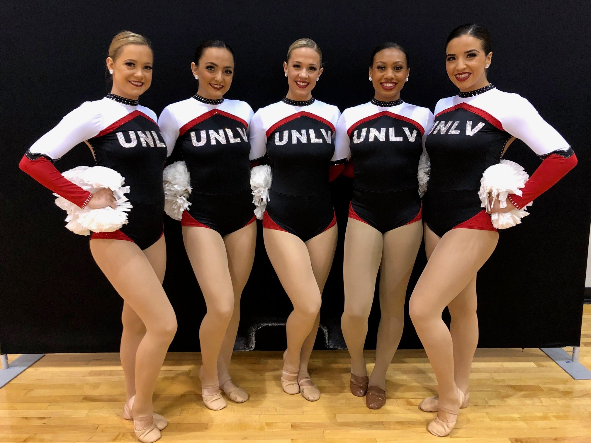 Team Spotlight UNLV Rebel Girls' Custom Pom Uniforms Are Traditional